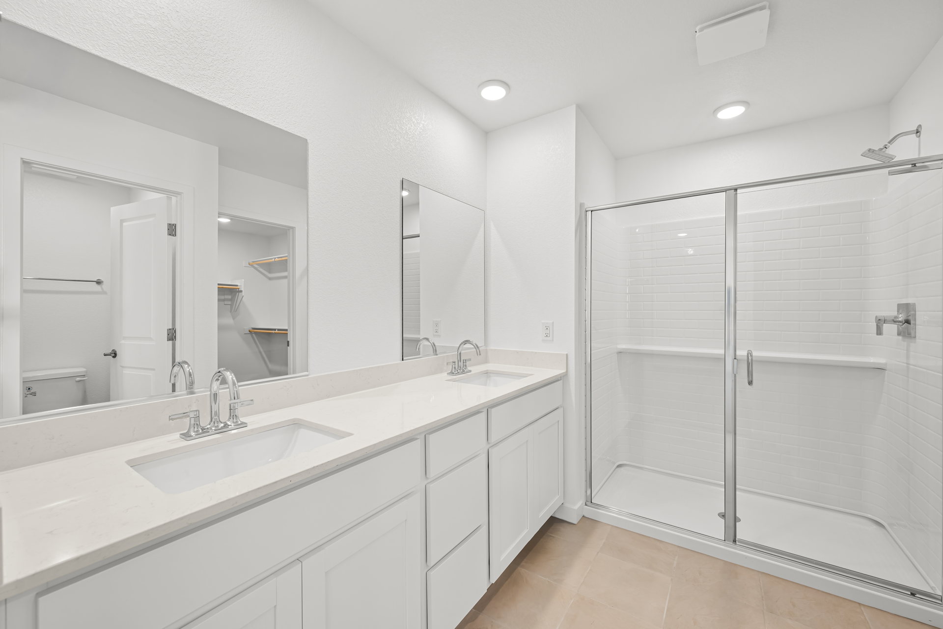 A bathroom with a glass shower.