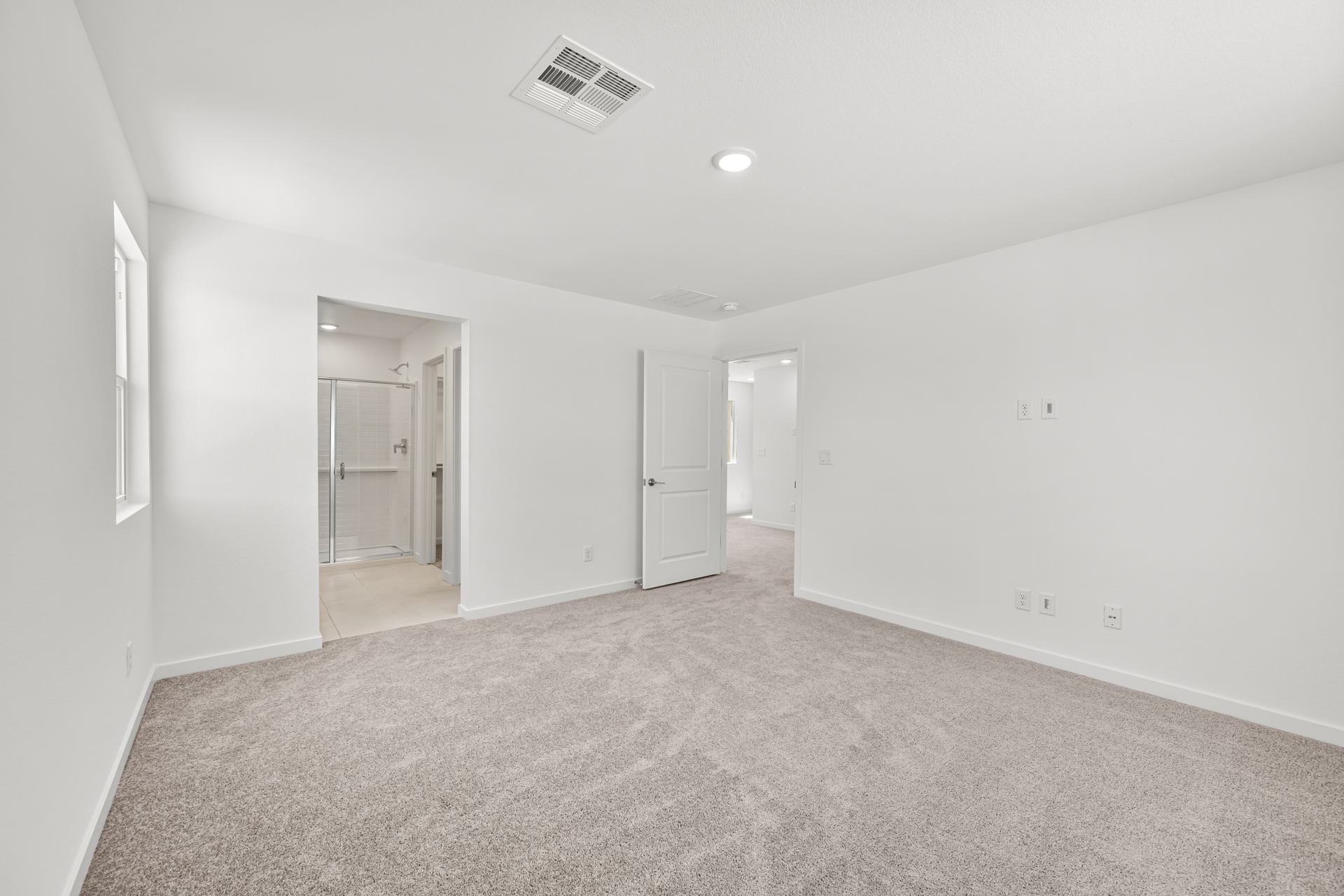 A long hallway with white walls.
