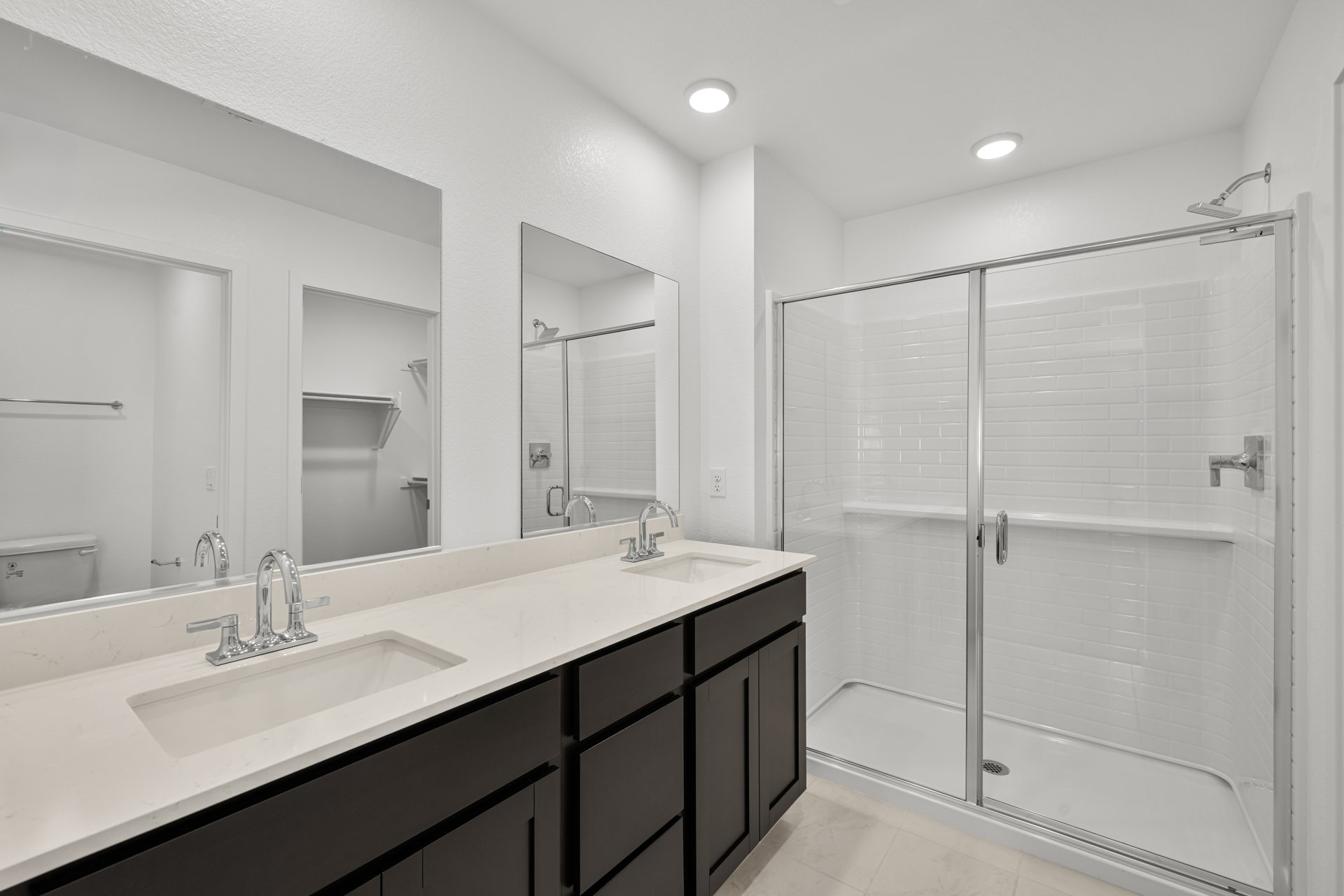 A bathroom with a glass shower.