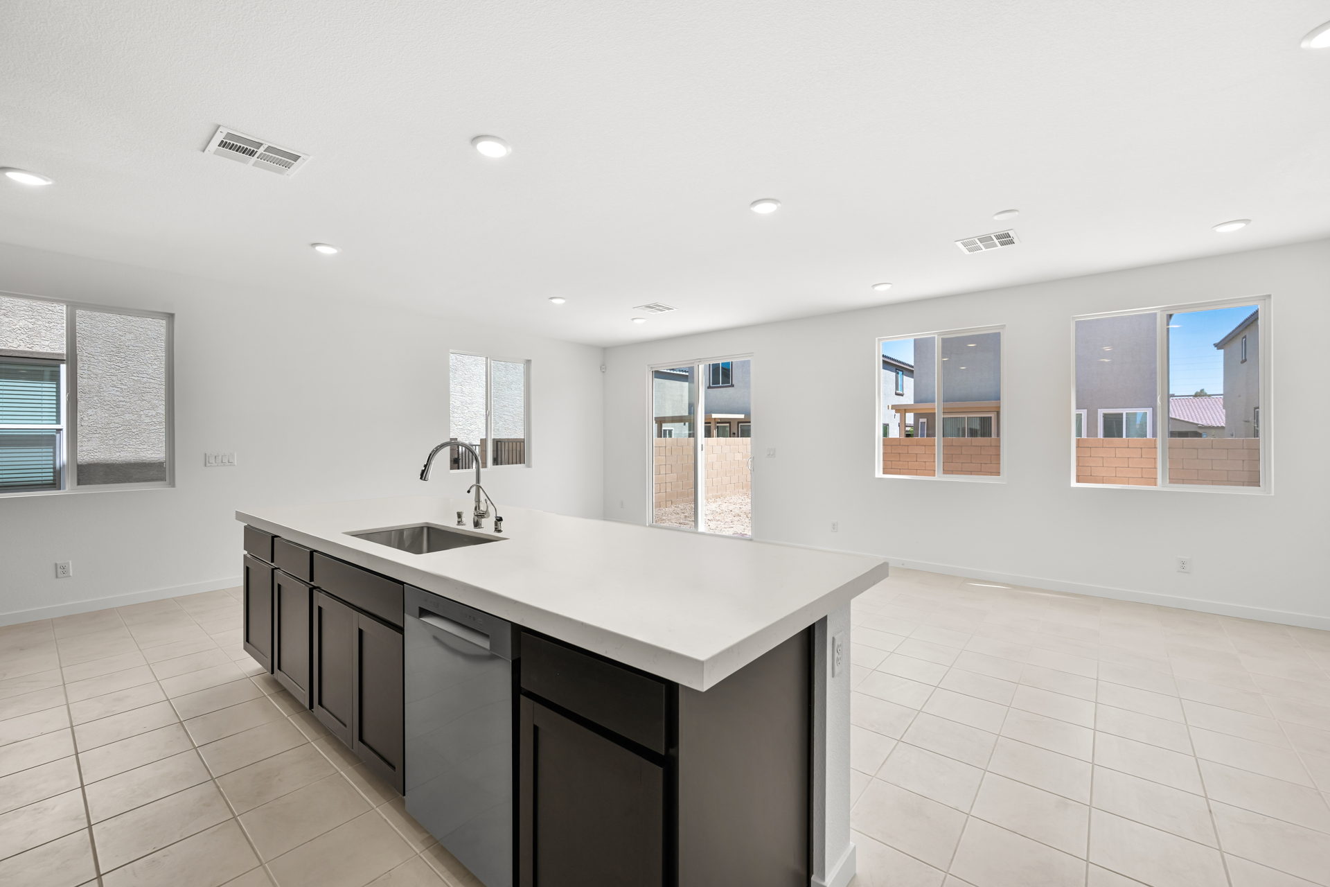 A kitchen with a sink and cabinets.