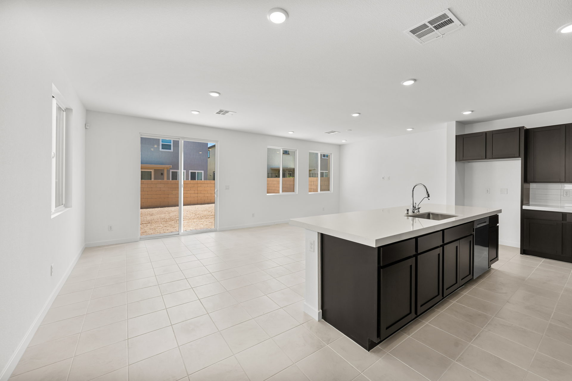 A kitchen with a large glass door.