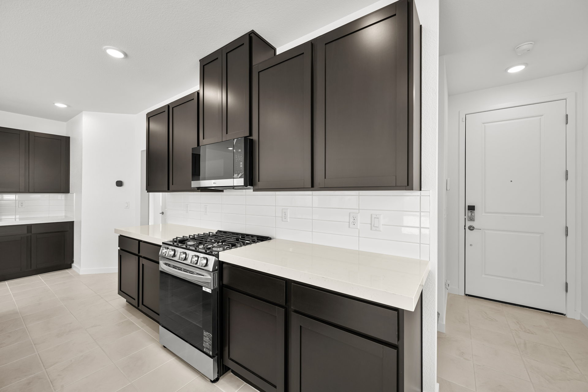 A kitchen with black appliances.