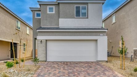A garage in a brick driveway.