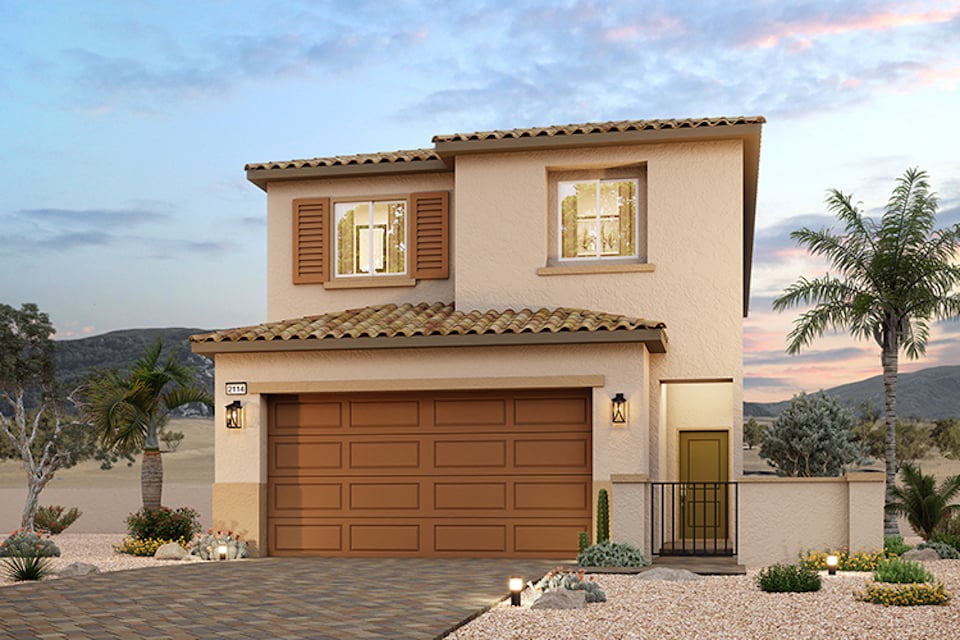 A house with a garage and trees.