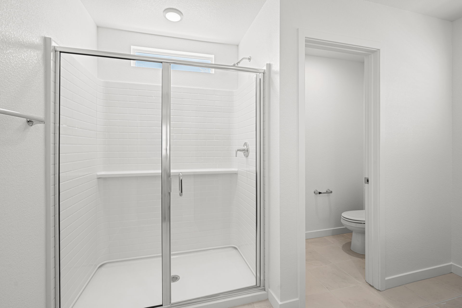 A bathroom with a glass shower.