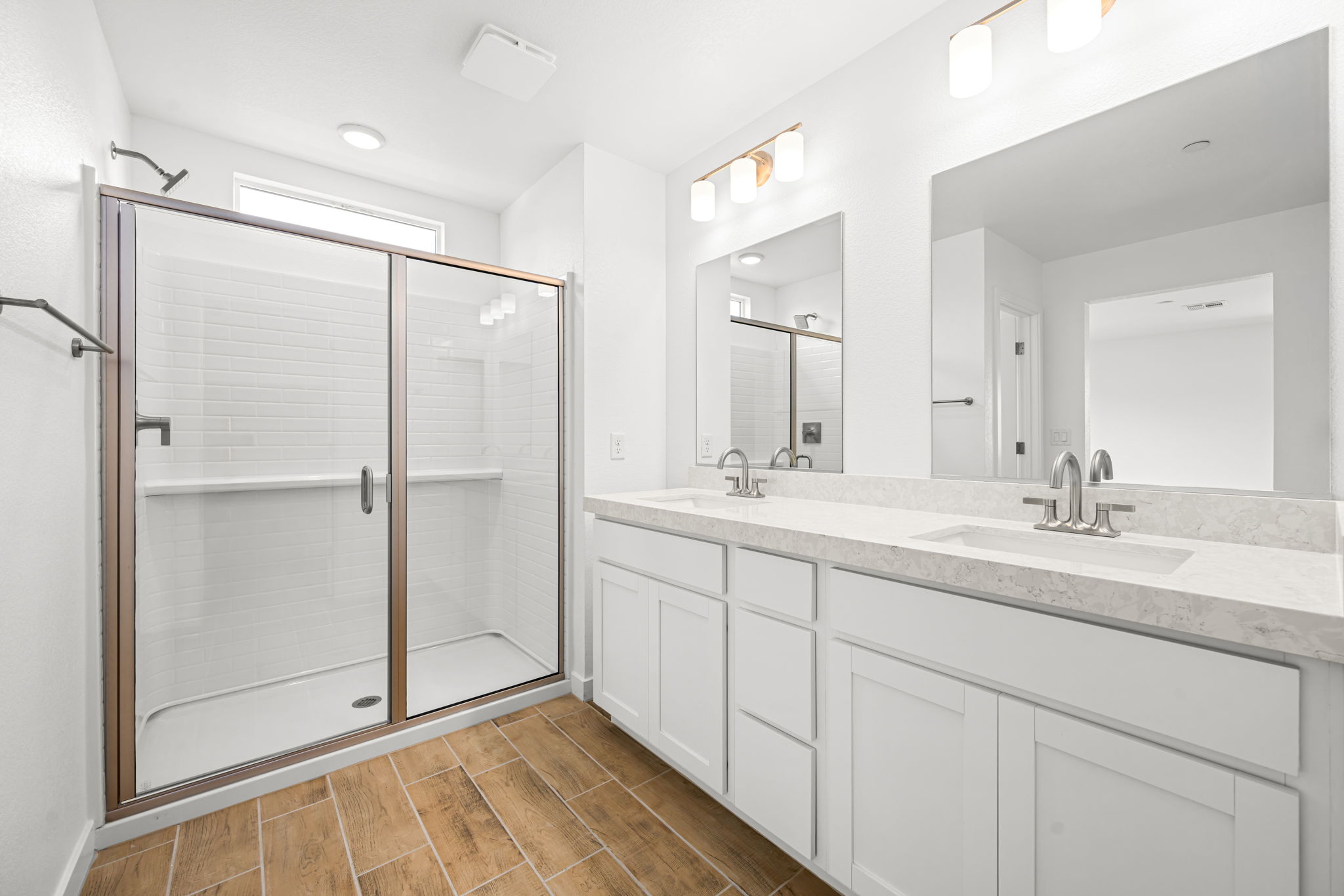 A bathroom with a glass shower.