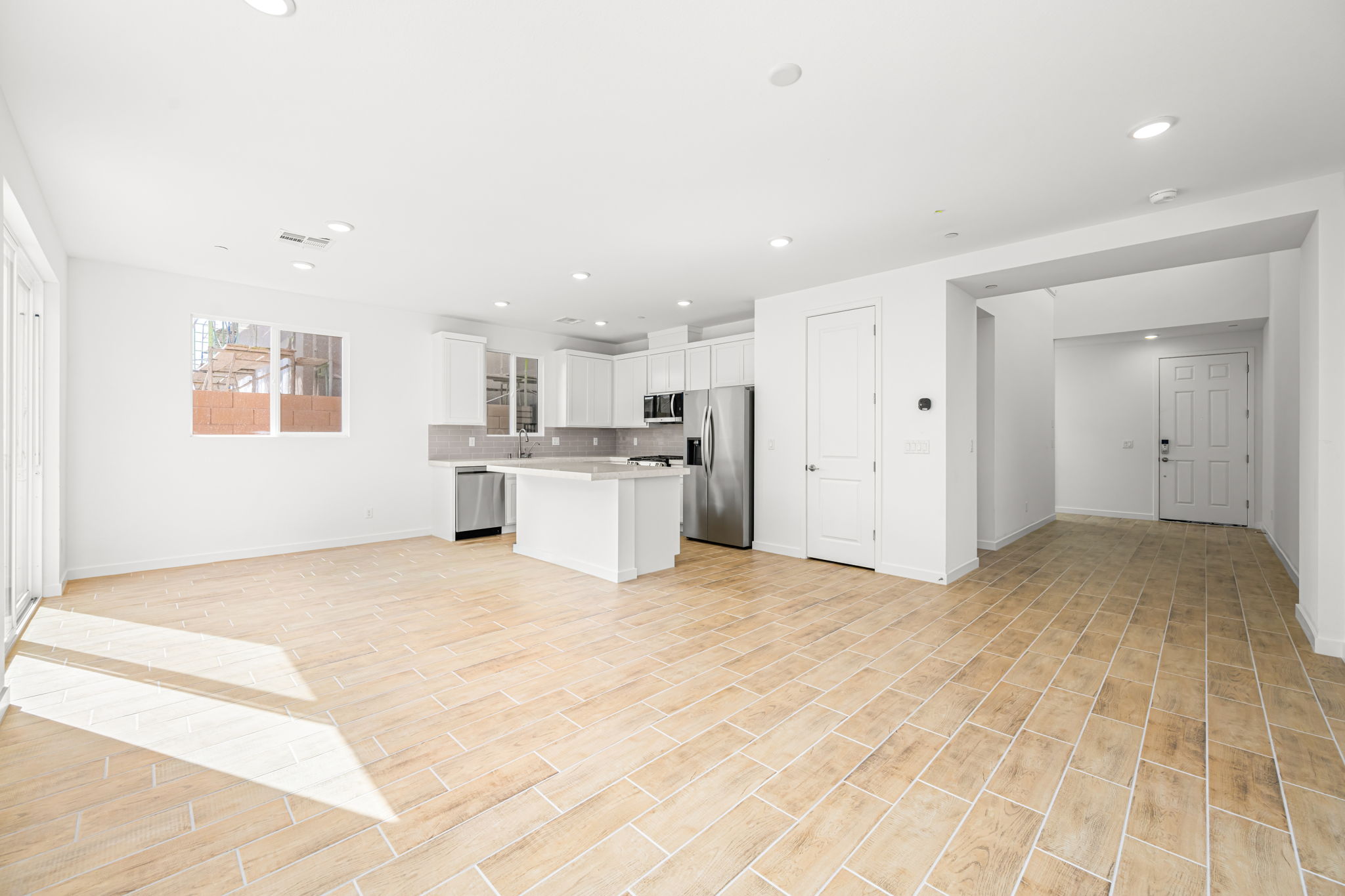 A large kitchen with white cabinets.