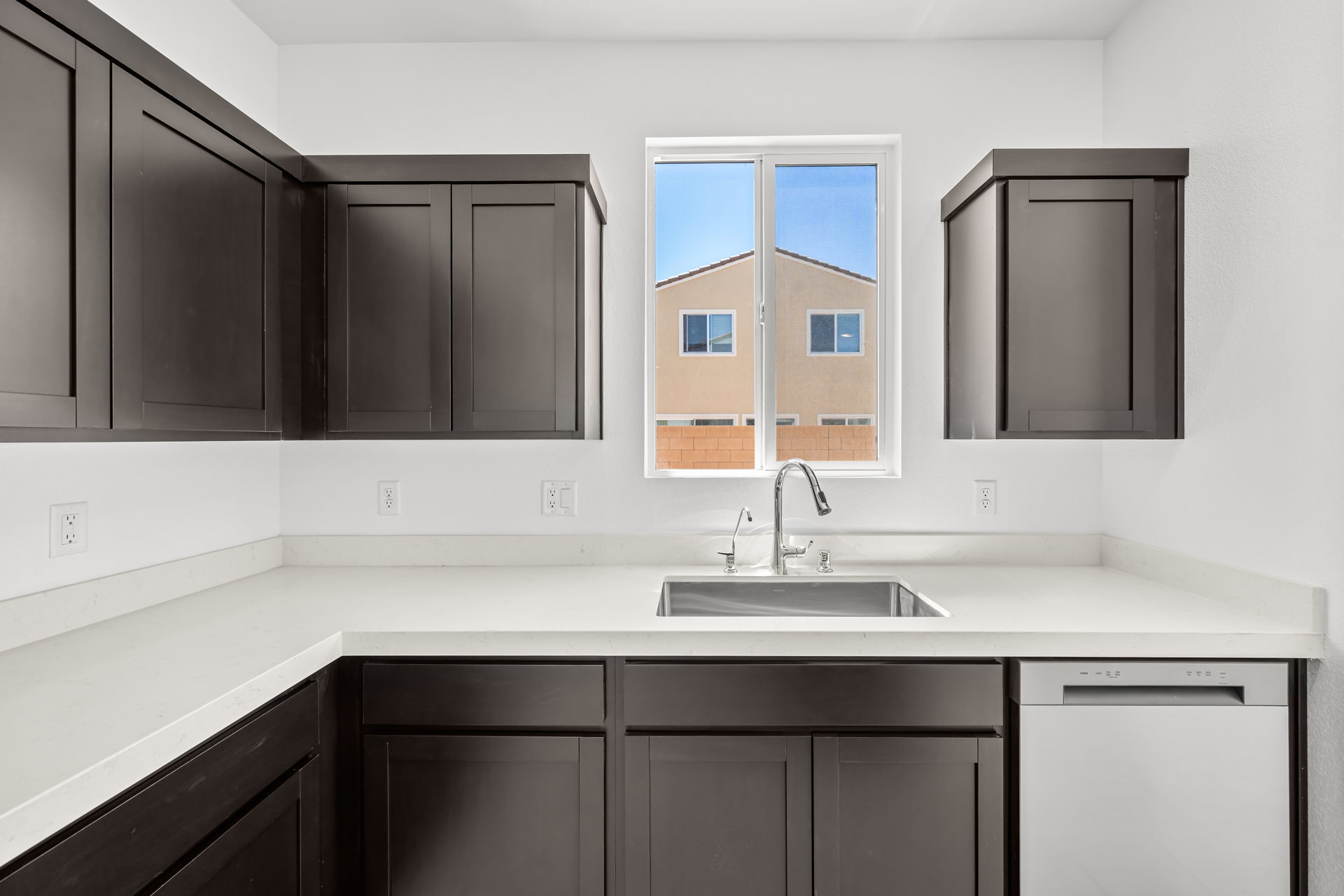 A kitchen with a sink and cabinets.