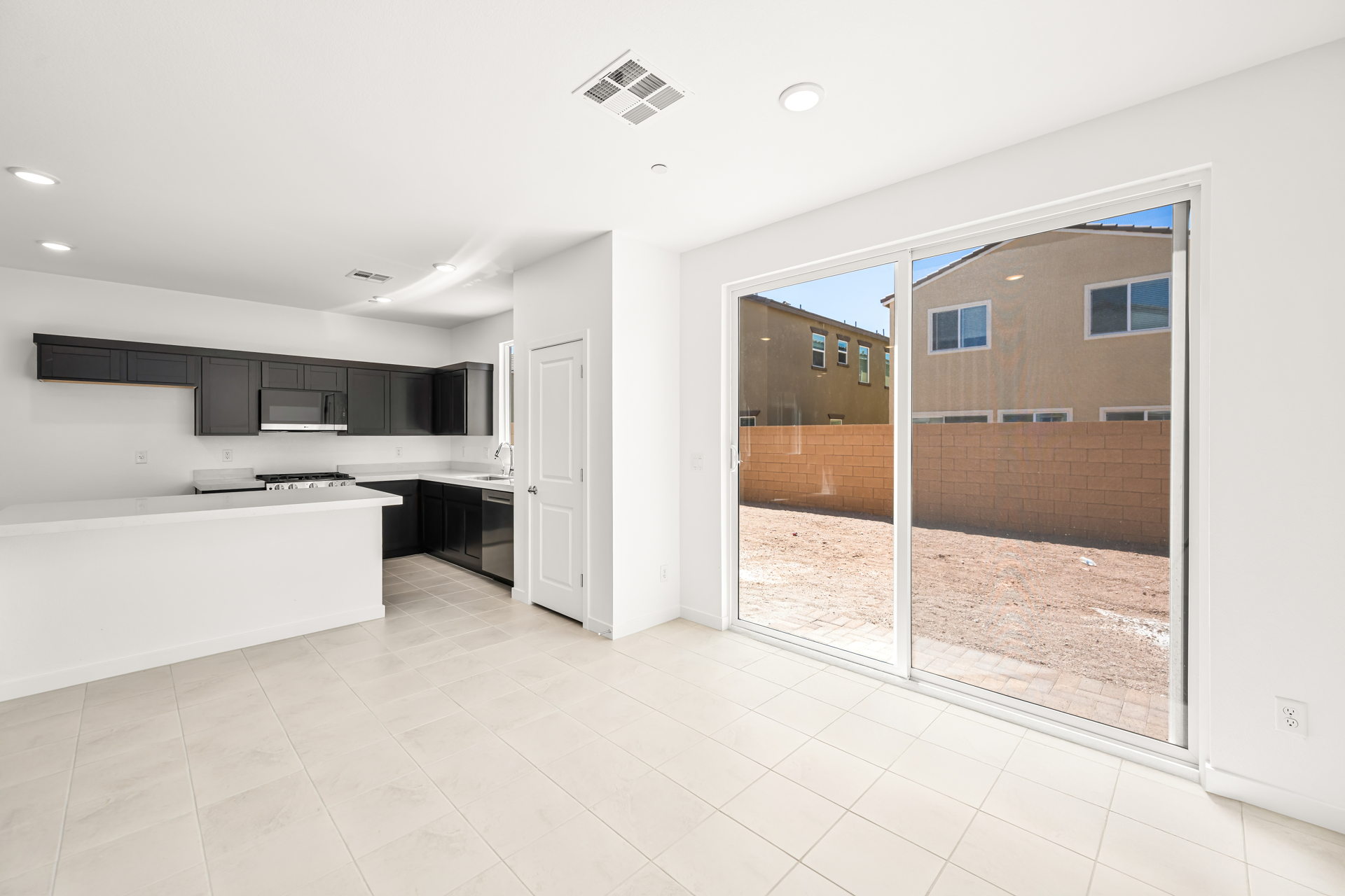 A room with a large glass door.