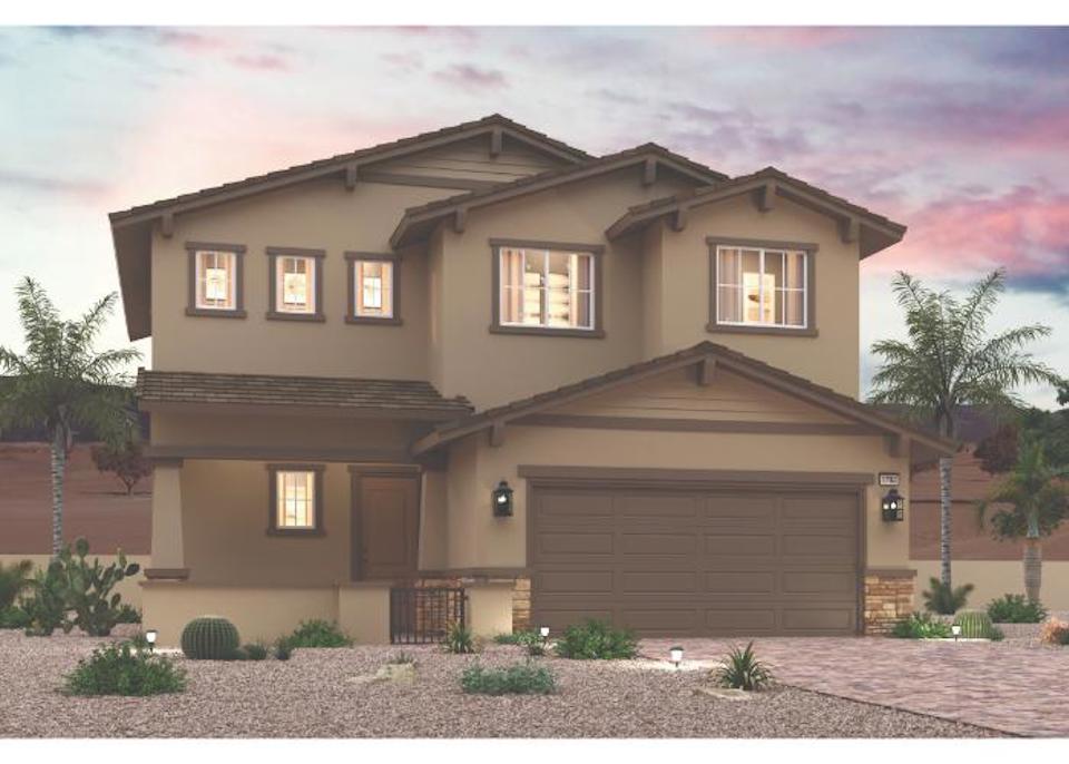 A house with a garage and trees.