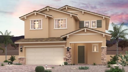 A house with a garage and palm trees.