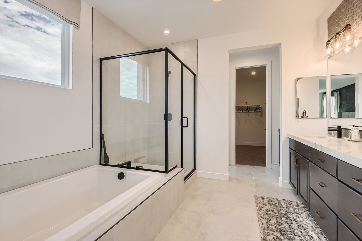 A bathroom with a tub and sink.