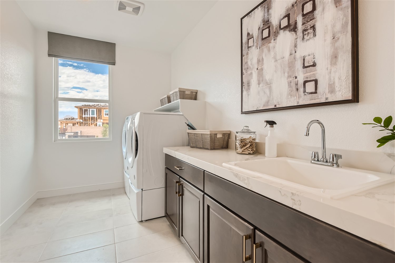 A kitchen with a sink and a window.