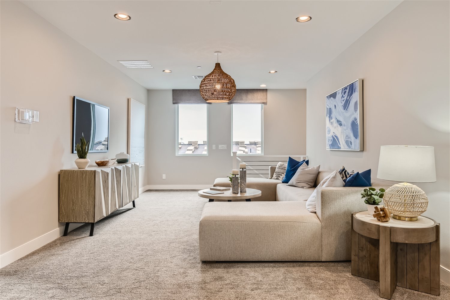 A living room with a couch and a table.