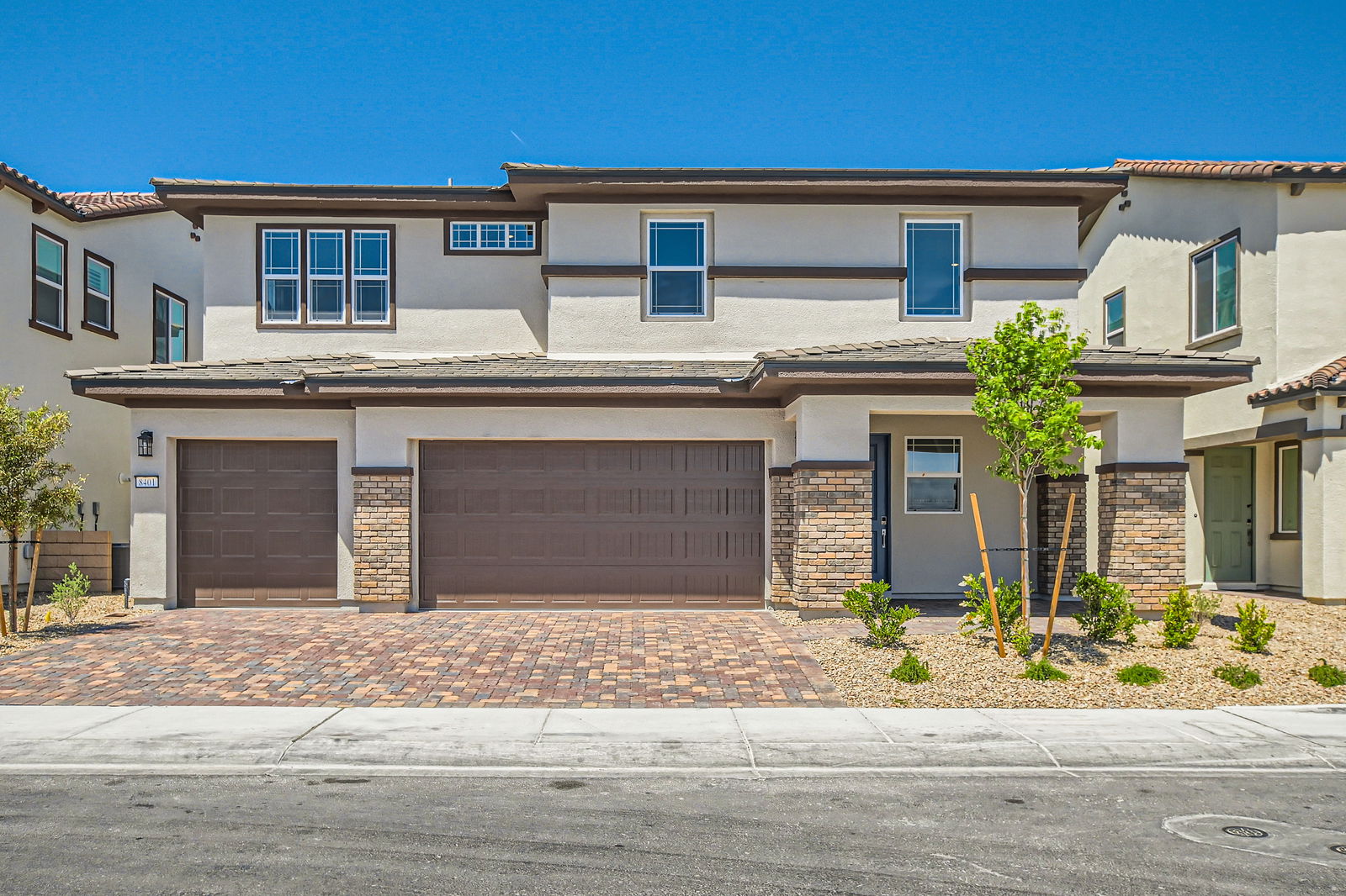 A building with garages and trees.