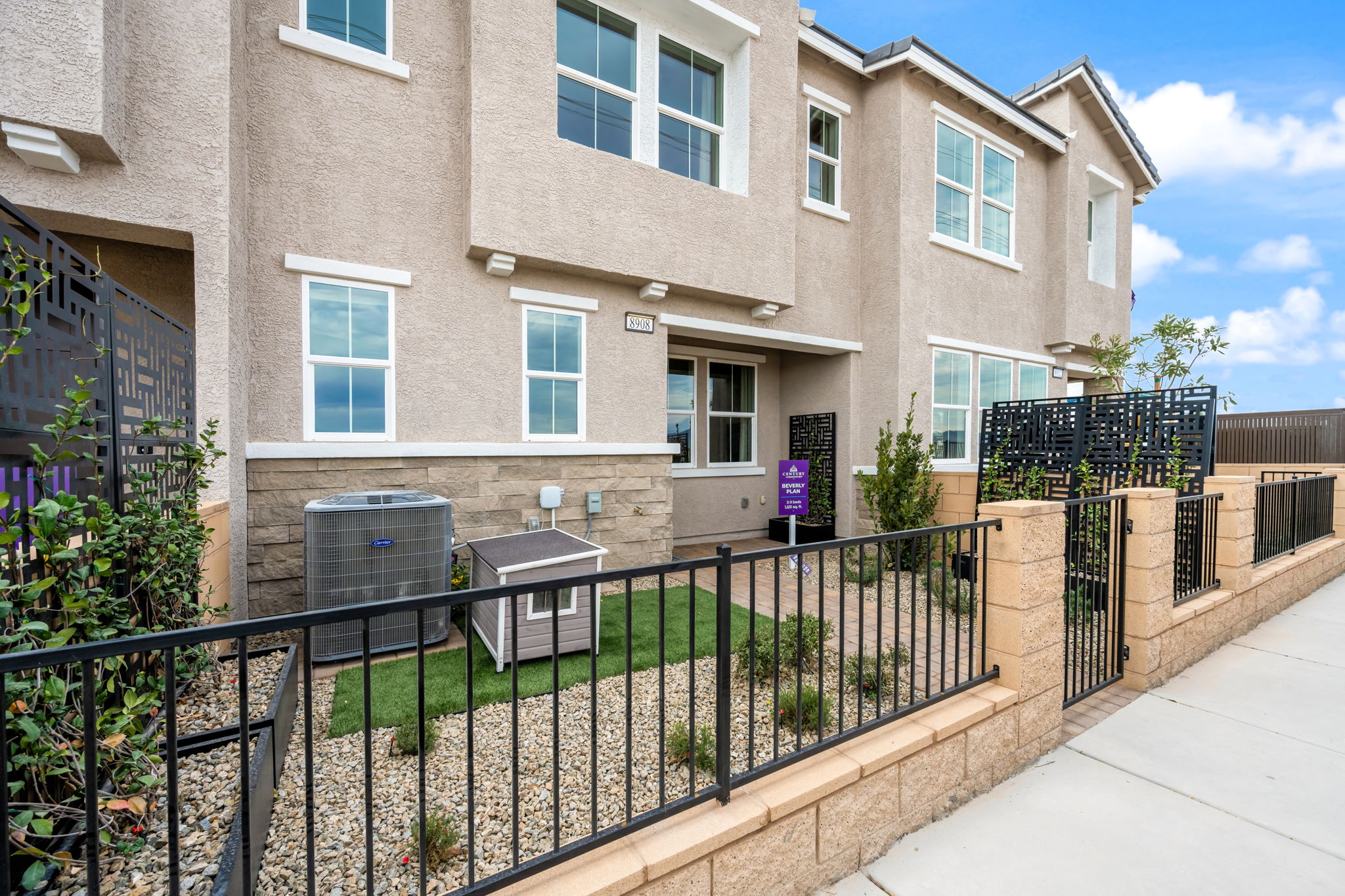 A building with a black fence.