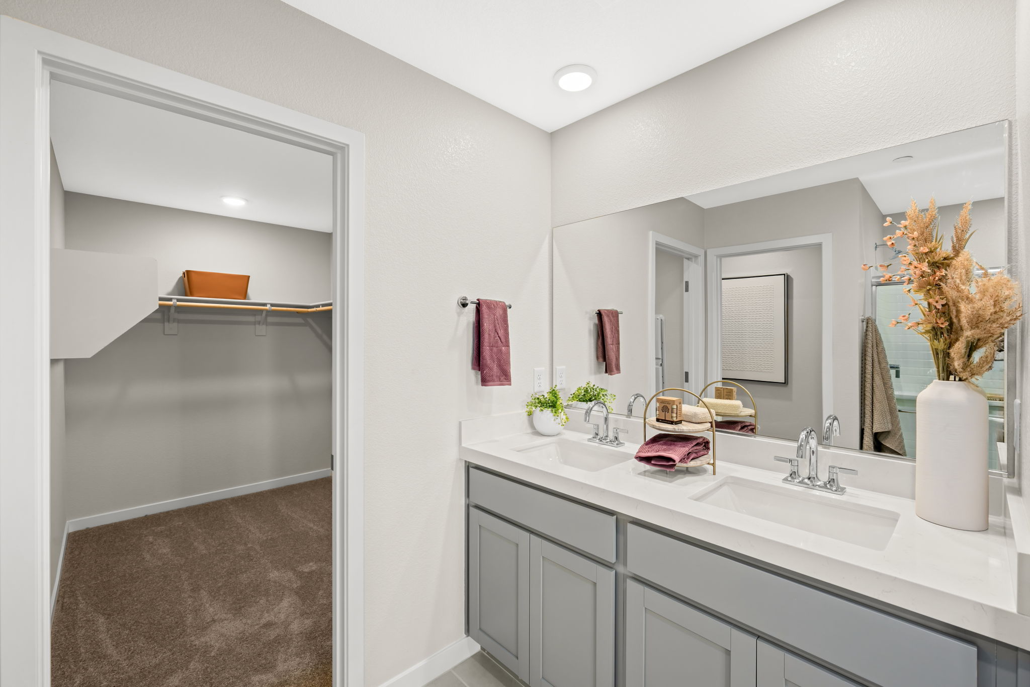 A bathroom with a shower and sink.