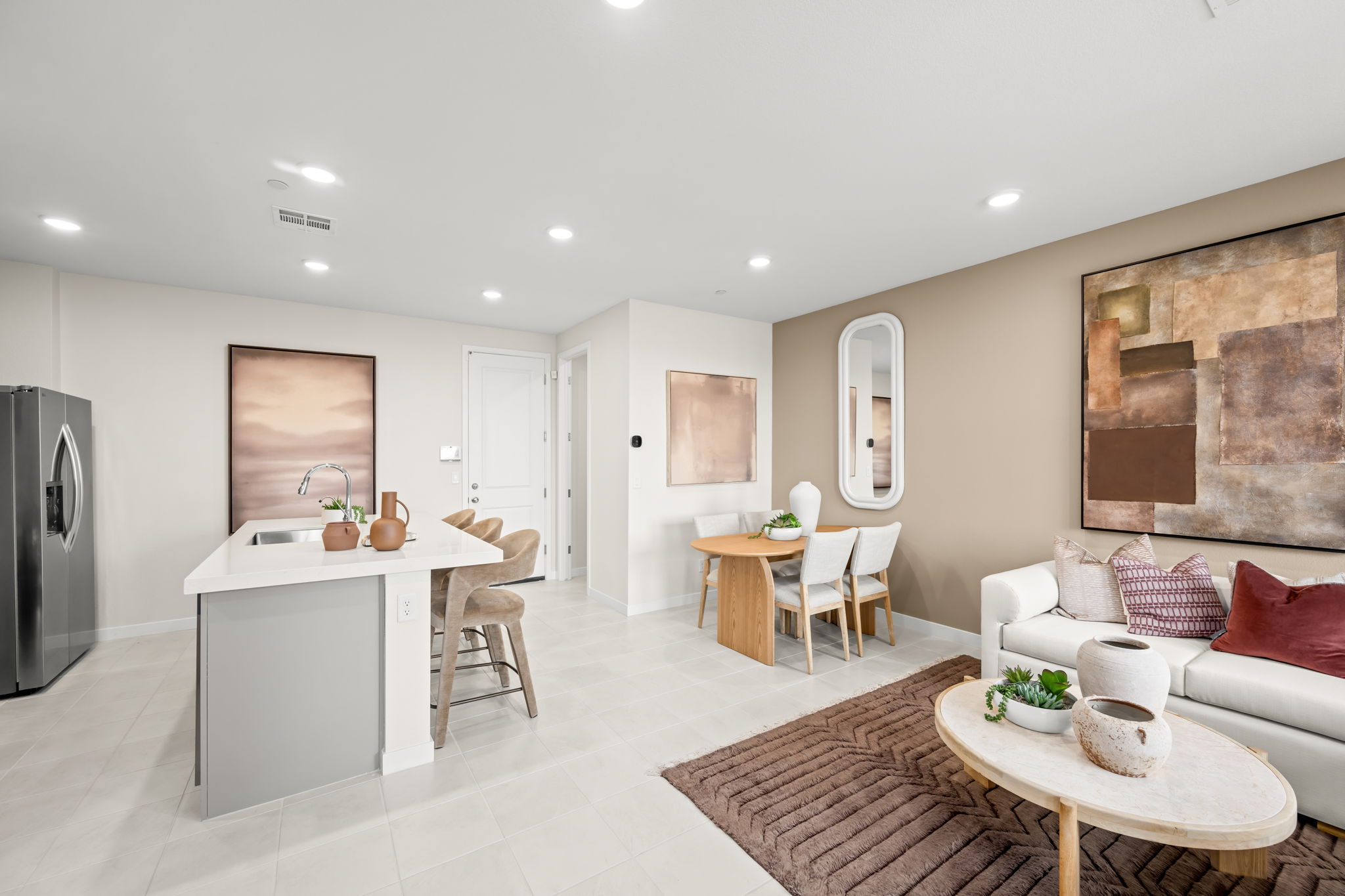 A large living room with a dining table and couches.