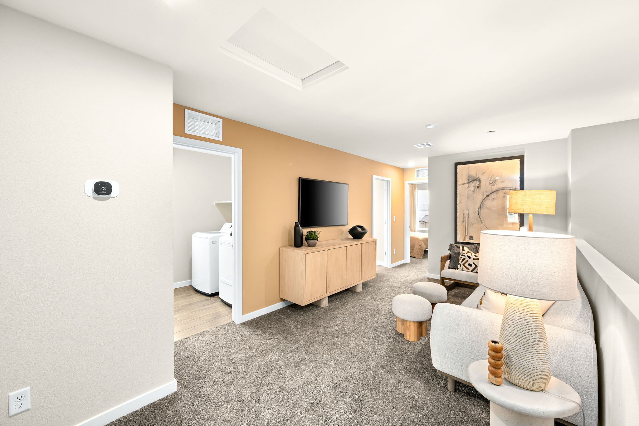 A living room with a tv and chairs.