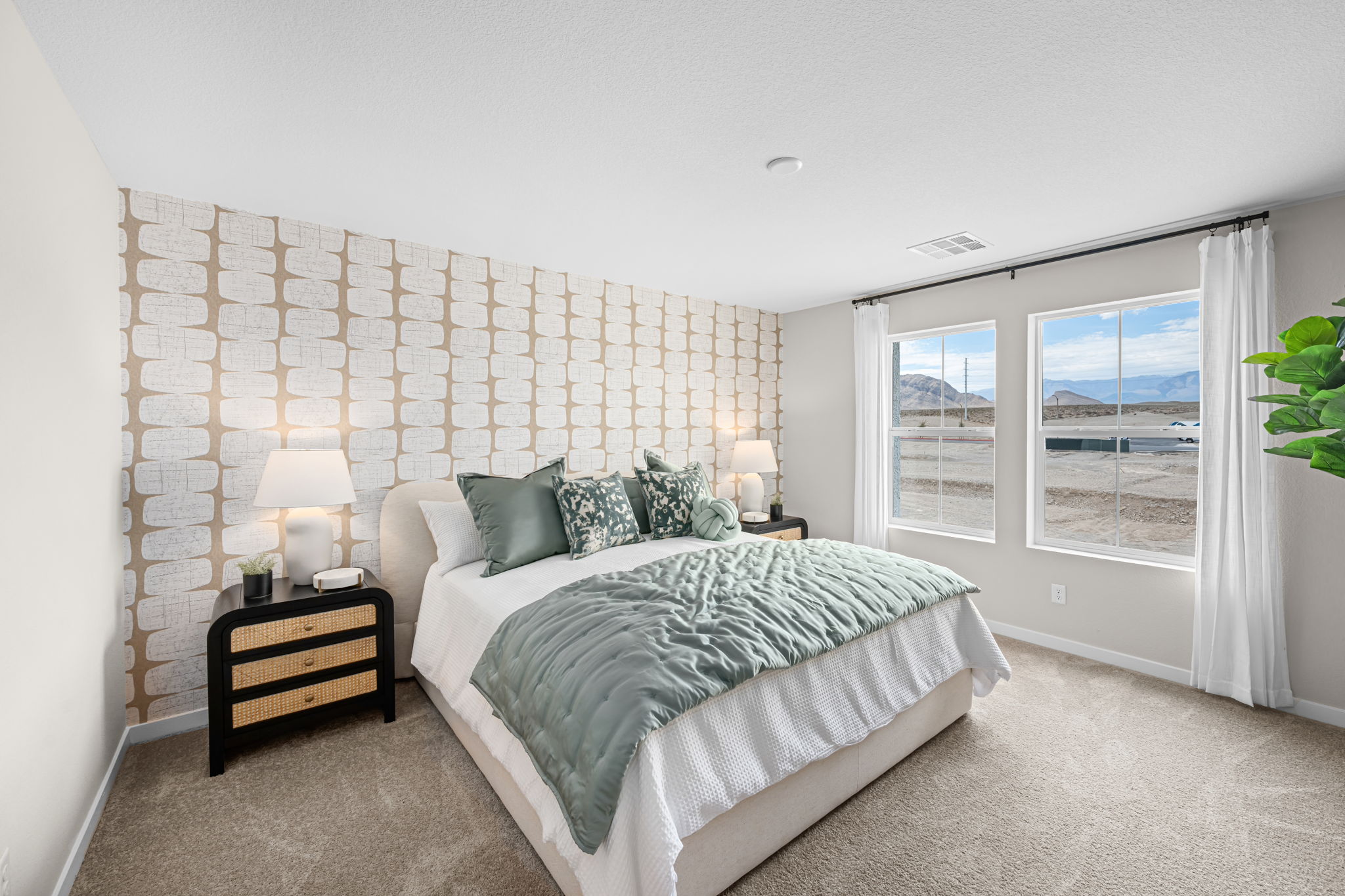 A bedroom with a bed and a window.