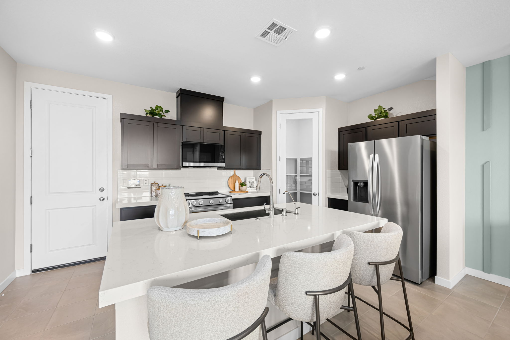 A kitchen with a dining table.