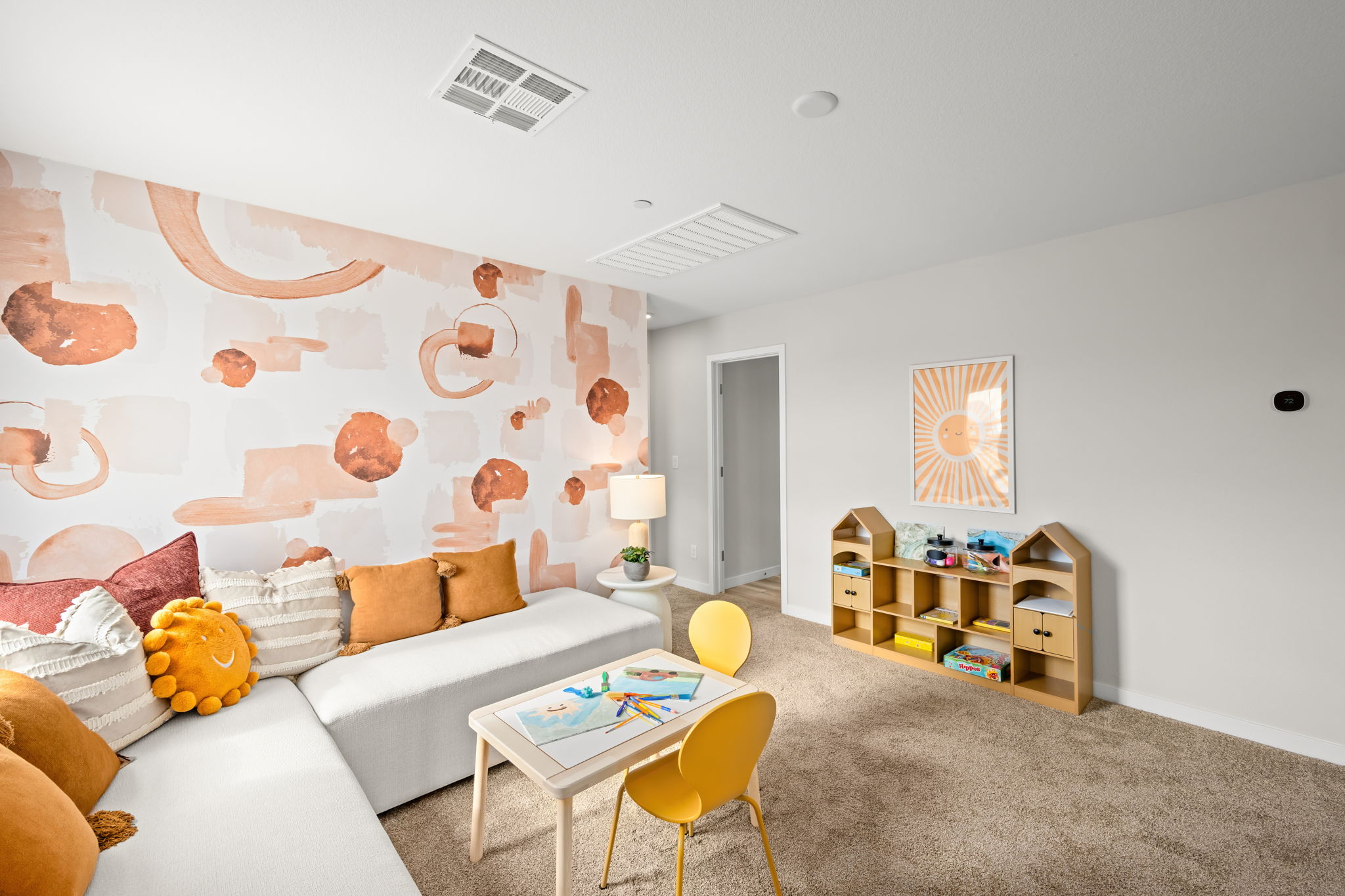 A living room with a couch and a table.