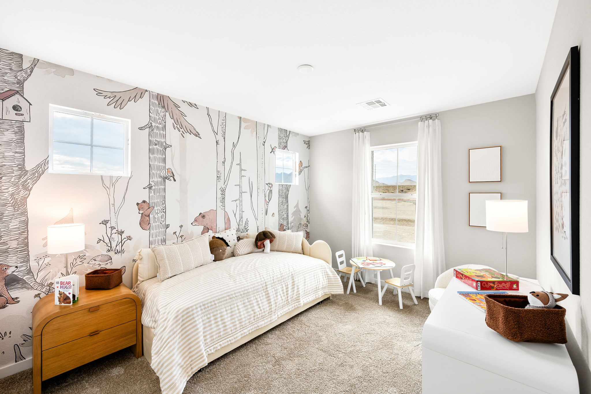 A bedroom with a bed and a couch.