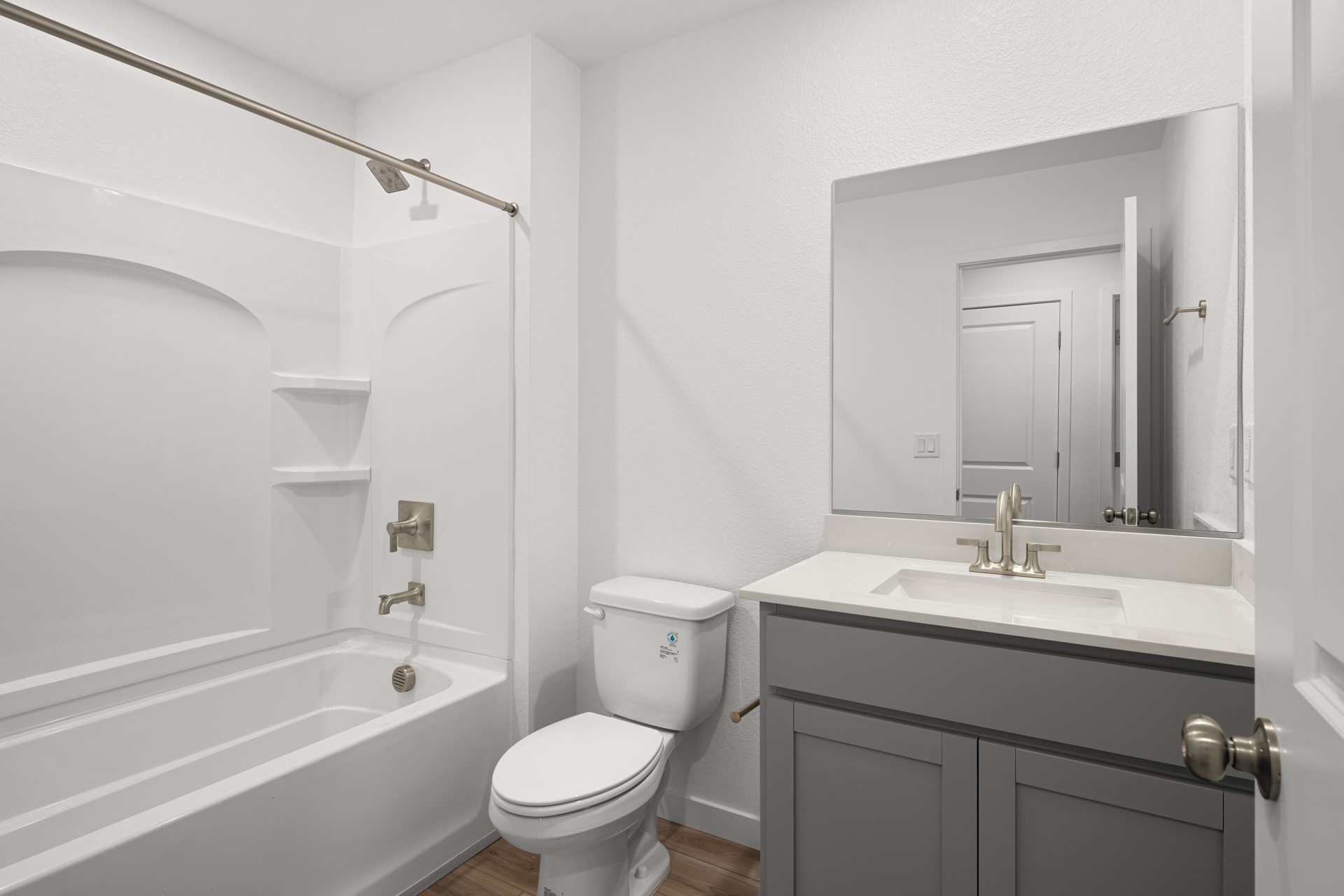 A bathroom with a toilet sink and bathtub.