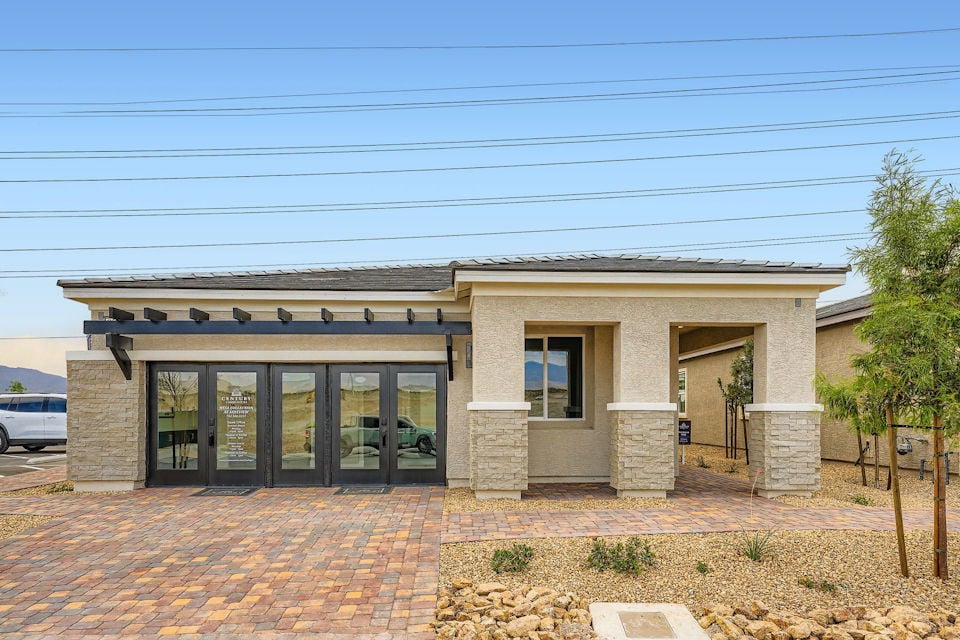A building with a brick driveway.