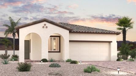 A house with a garage and palm trees.