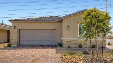 A house with a brick driveway.