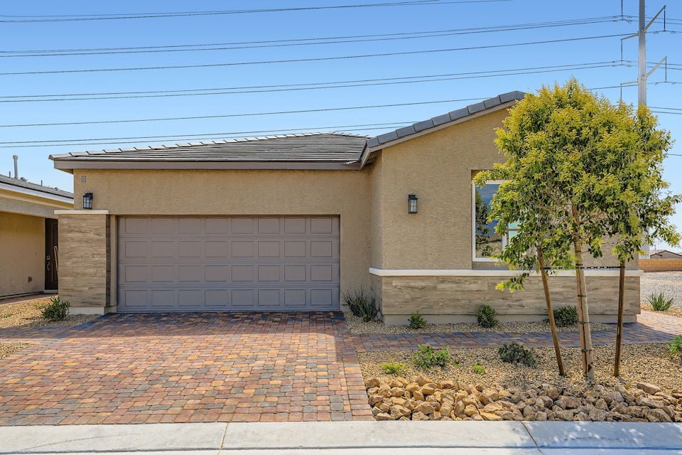 A house with a brick driveway.