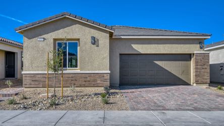 A building with a brick driveway.