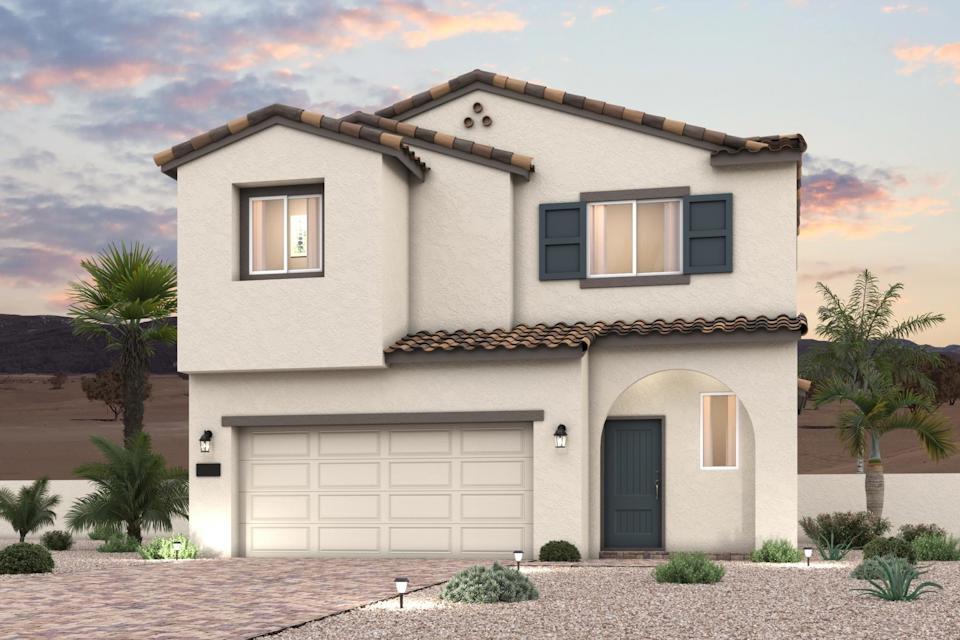 A house with a garage and palm trees.