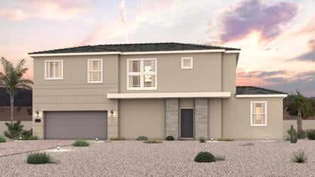 A house with a gravel driveway.