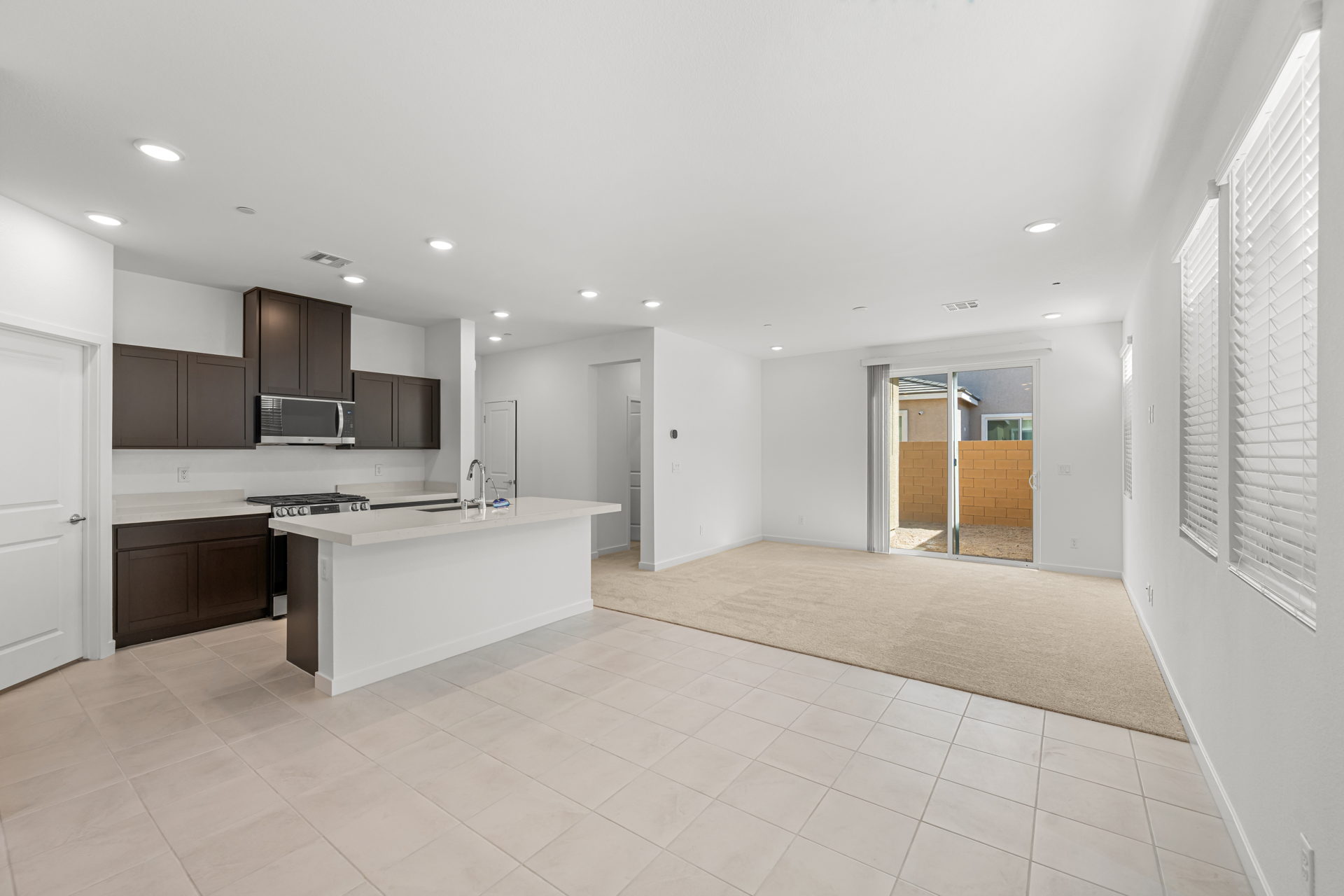 A large kitchen with white tile.