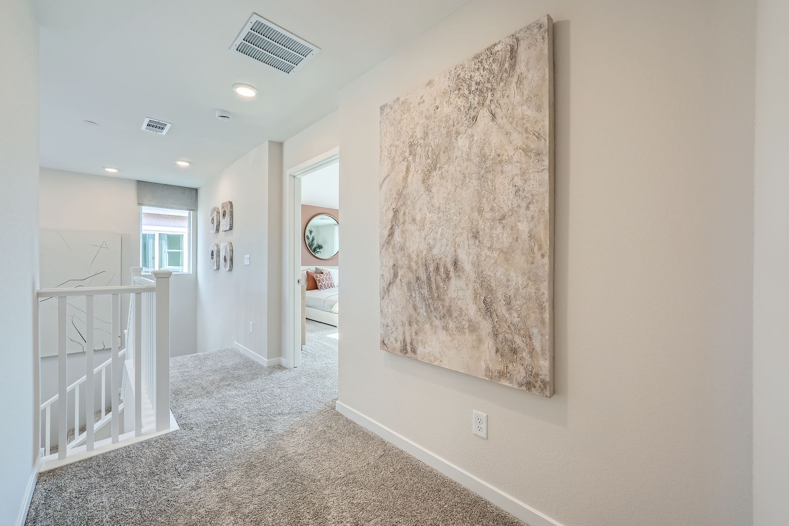 A room with a wall of art.