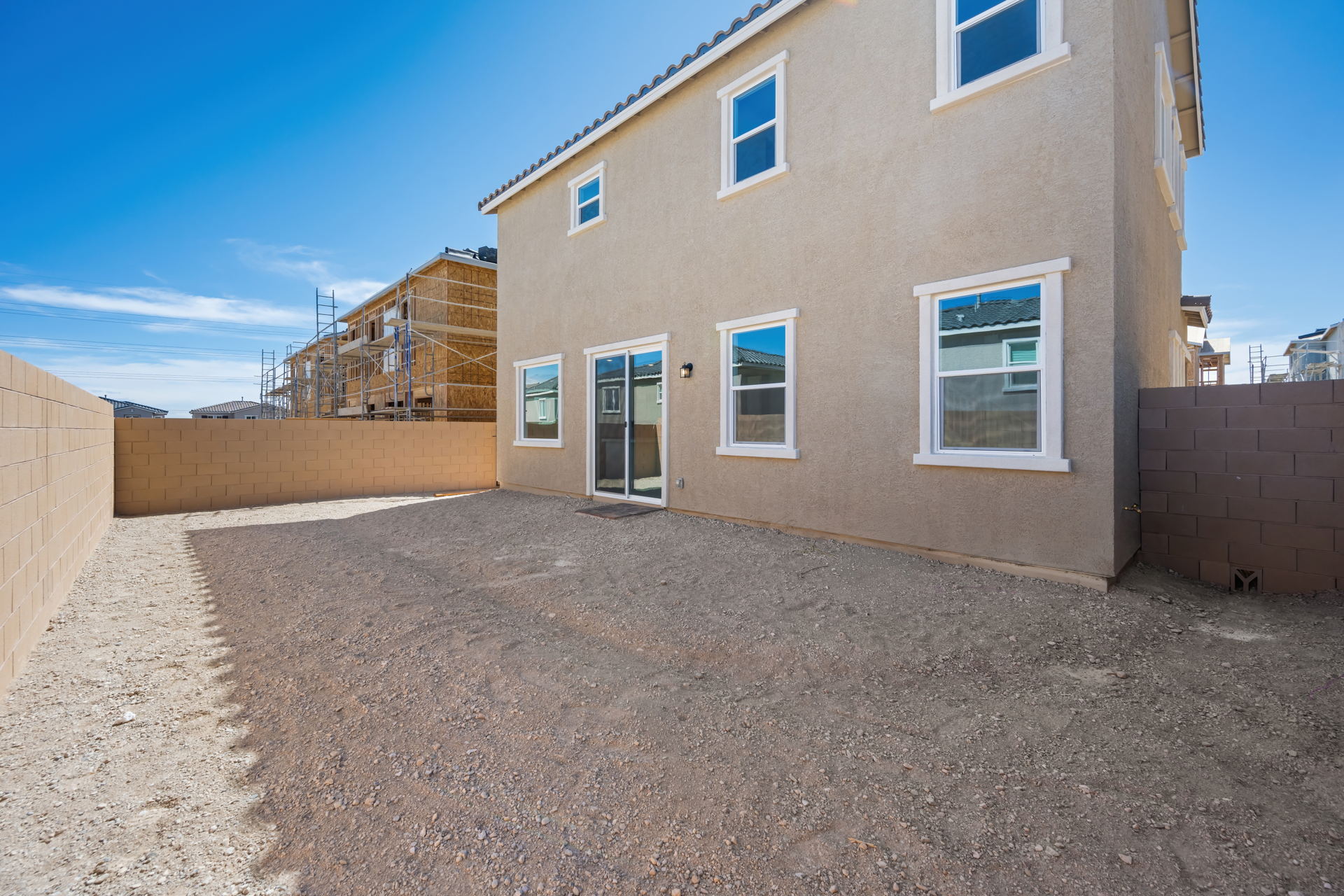 A building with a dirt road.
