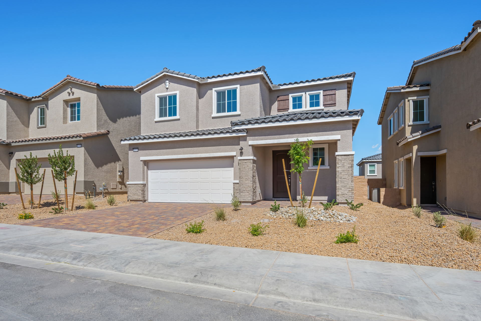 A large house with a driveway.