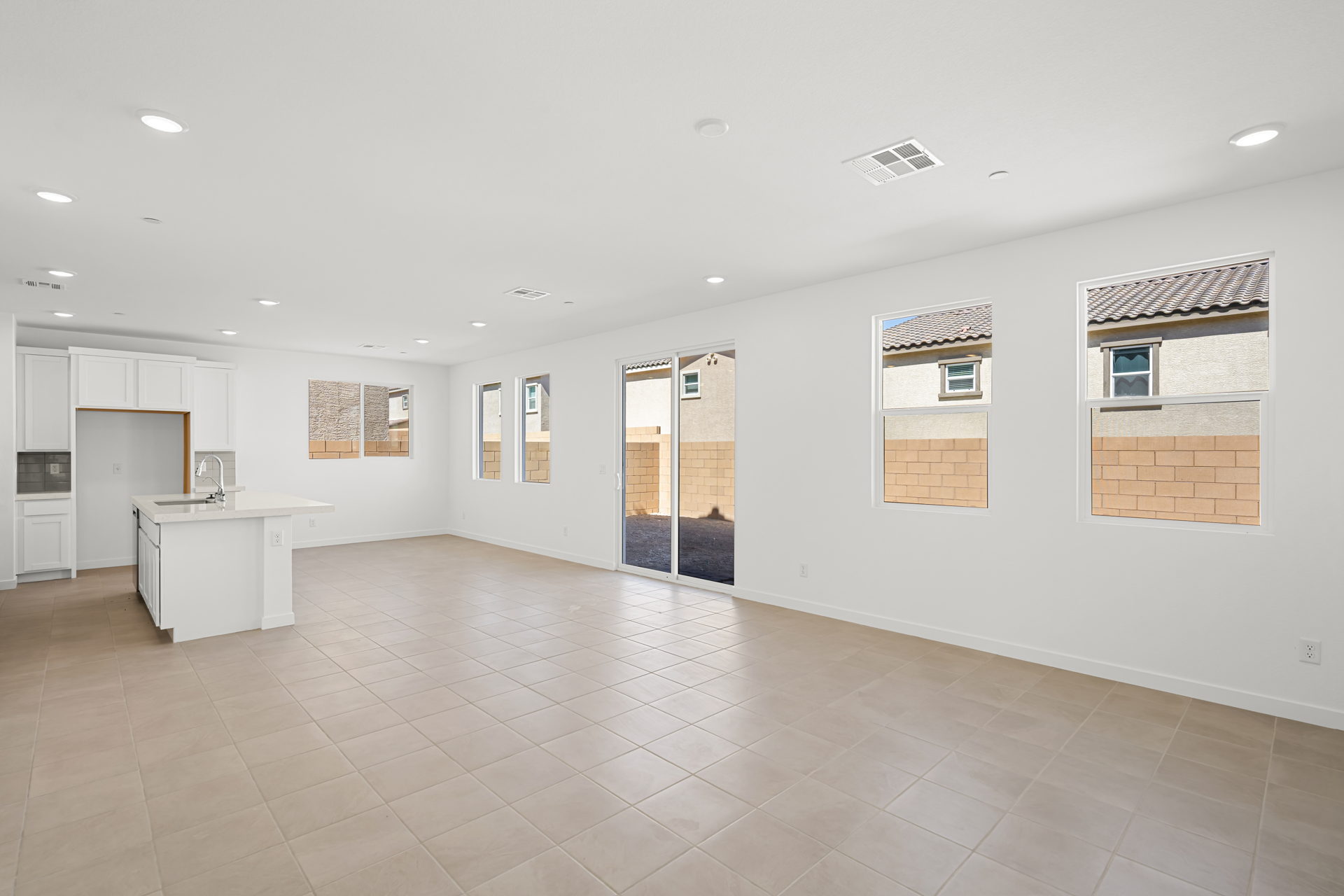 A large empty room with a white counter and a white counter.
