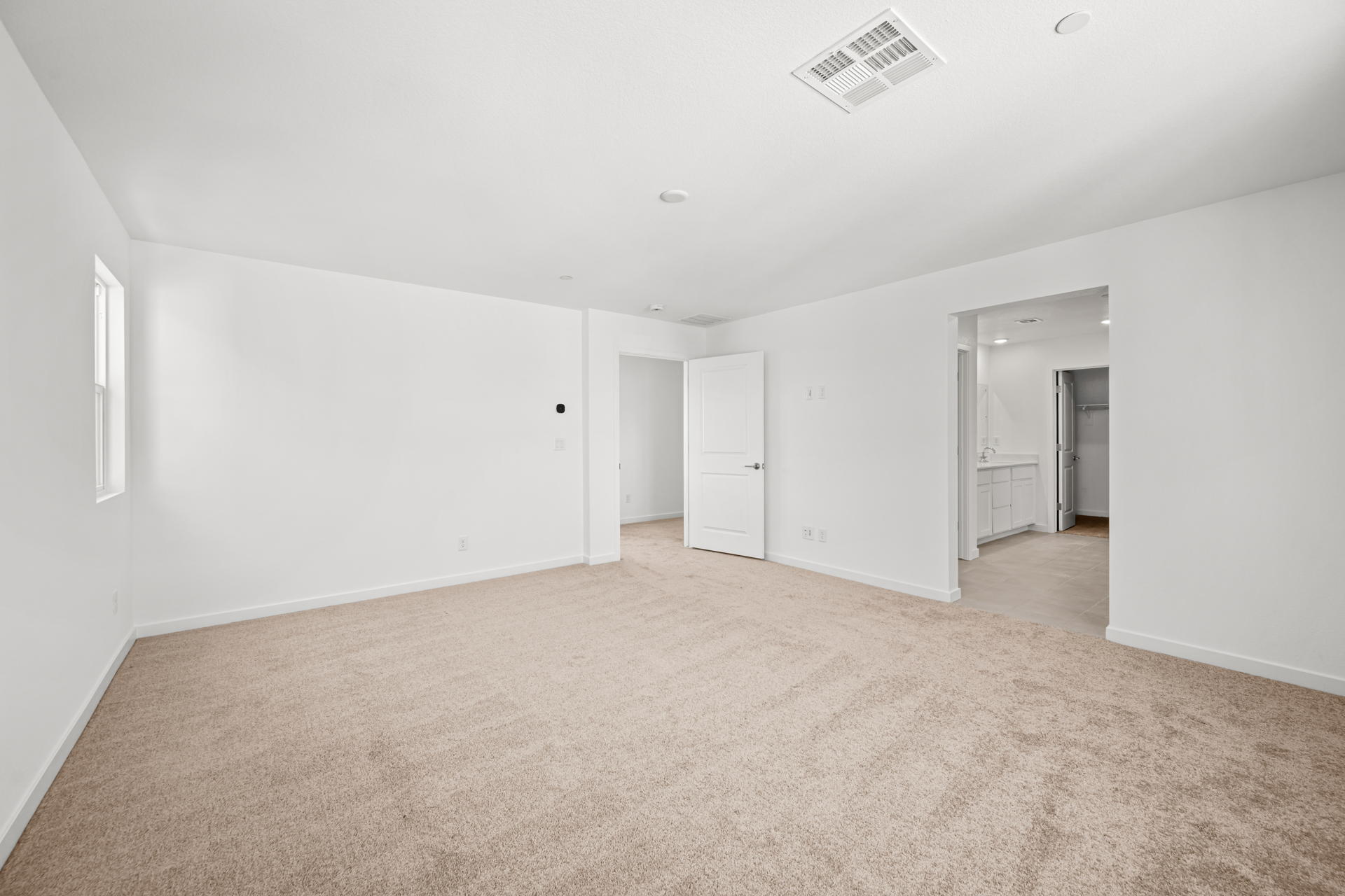 A long hallway with white walls.