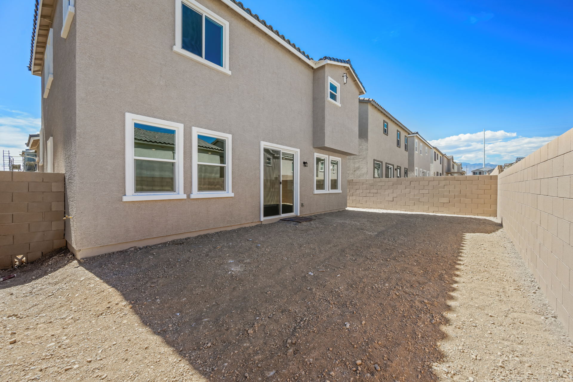 A building with a dirt road.