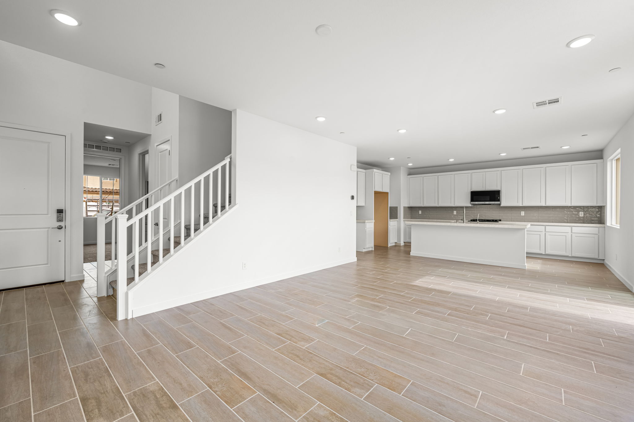 A large empty room with white walls.