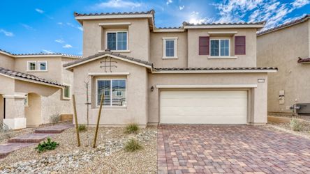 A house with a brick driveway.