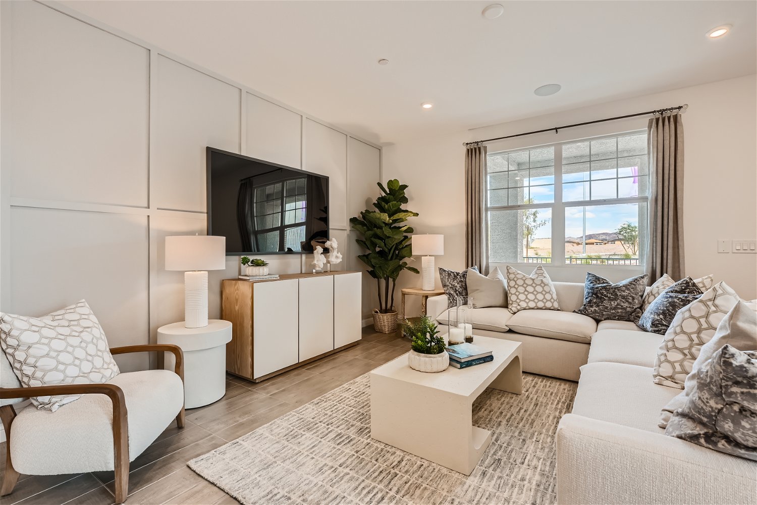 A living room with a tv and couches.