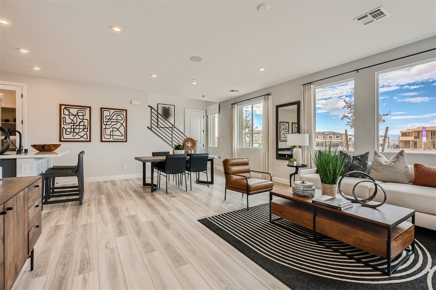 A large living room with a large window.