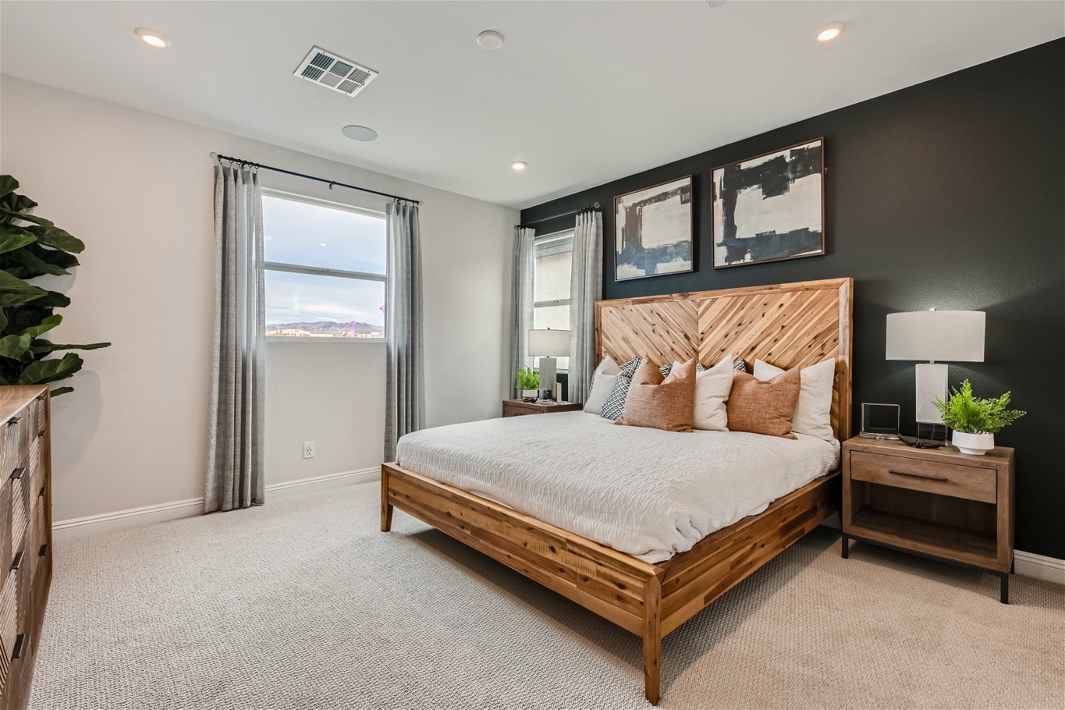 A bedroom with a large bed.