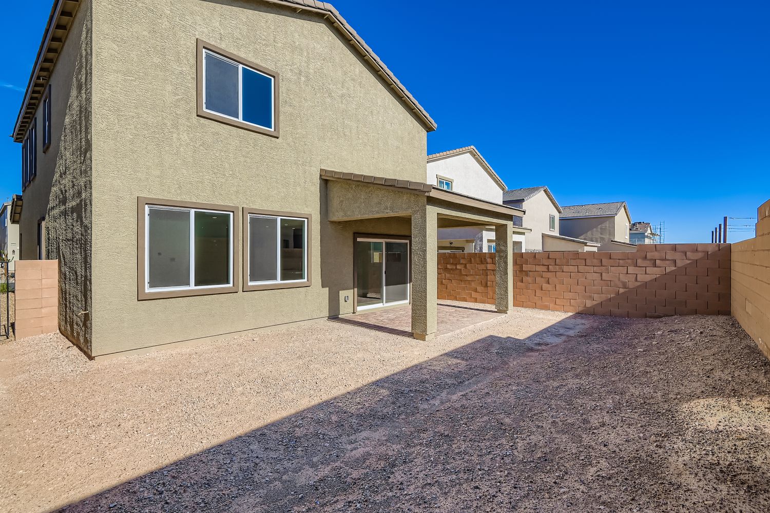 A house with a brick driveway.