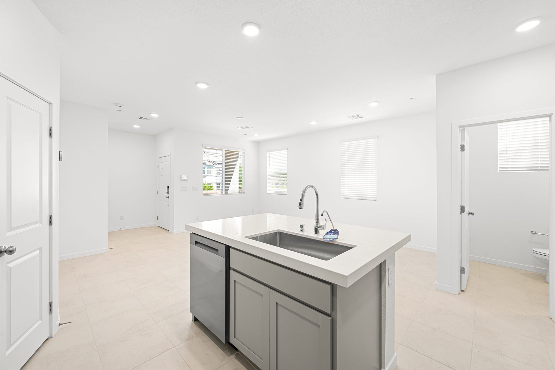 A large kitchen with white cabinets.