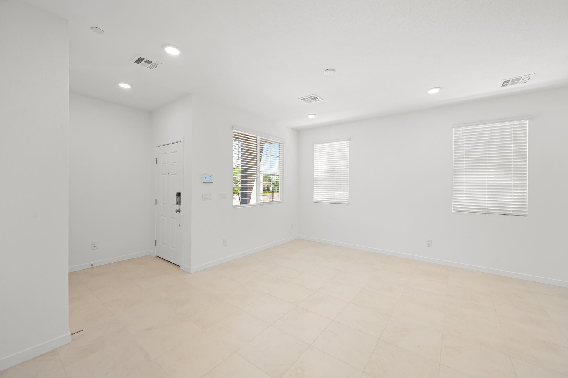 A room with white walls and windows.